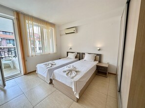 Apartemen Klasik, pemandangan kolam renang | 2 kamar tidur, Wi-Fi (biaya tambahan), dan seprai linen