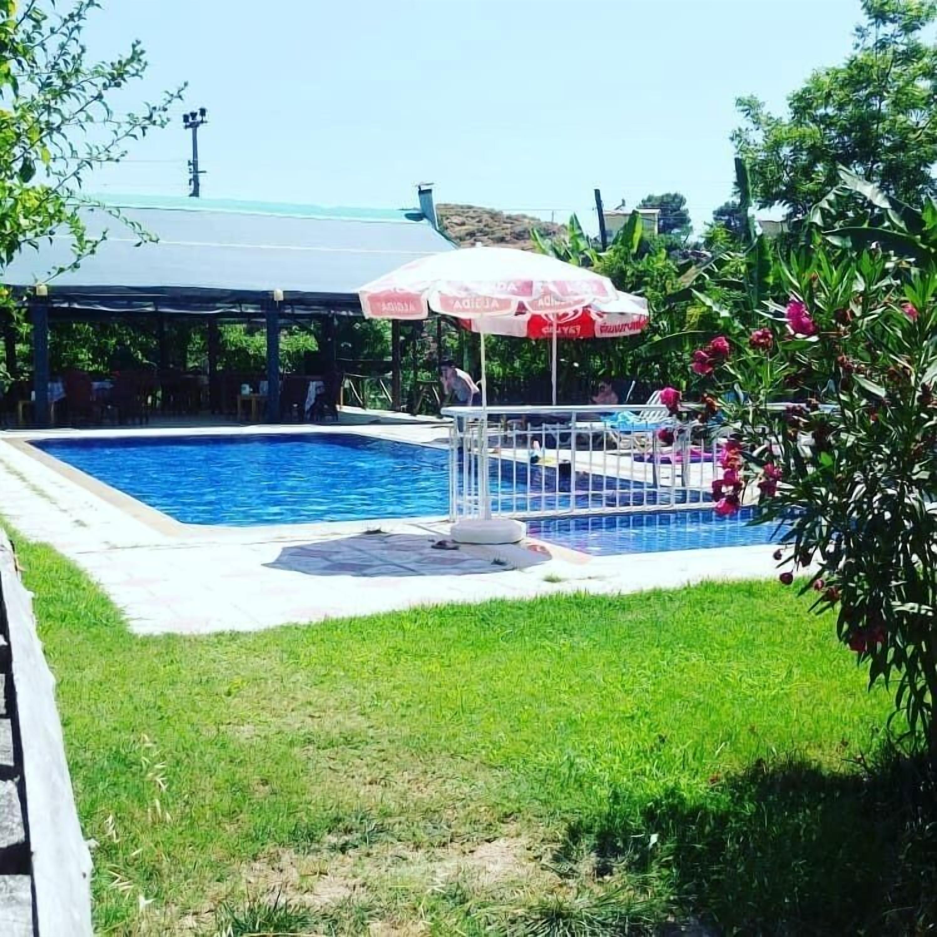 outdoor pool, pool umbrellas, pool loungers