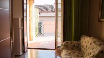 Deluxe Triple Room, Shared Bathroom | In-room safe, rollaway beds, free WiFi, bed sheets