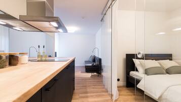 Apartment, 1 Bedroom | Laptop workspace, blackout drapes, soundproofing, iron/ironing board