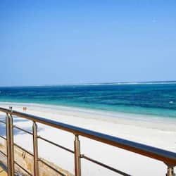 On the beach, white sand, sun loungers