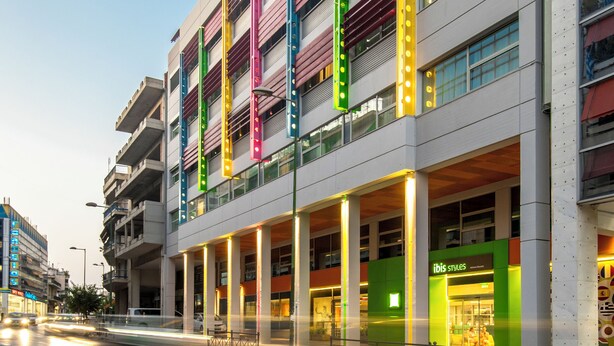 A multi-story building with a modern design, featuring balconies and large windows. - ibis Styles Athens Routes (Athens)