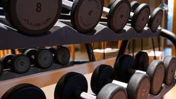 A rack of dumbbells with weight markings.