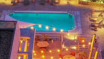 Seasonal outdoor pool, open 10:00 AM to 8:00 PM, pool umbrellas