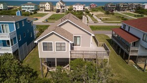 A coastal residential area with houses featuring balconies and a view of the ocean. - Simply Perfect - S Nags Head MP 19.5, 120 Yds to Beach, Ocean View, Community Pool, Tennis (South Nags Head)