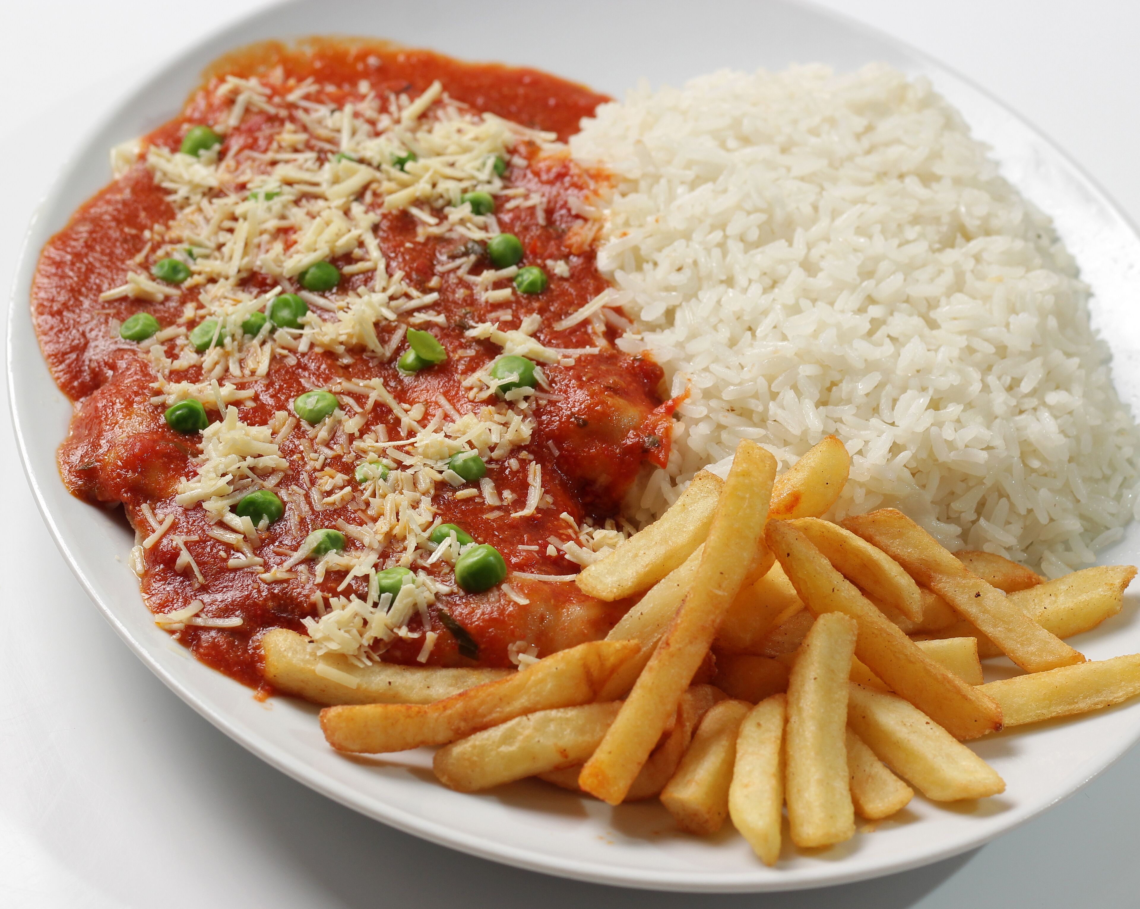 A plate with a serving of pasta, rice, and French fries.