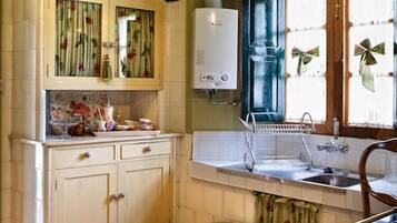 Apartment, 3 Bedrooms (La Casa) | Private kitchen | Full-sized fridge, microwave, stovetop, coffee/tea maker