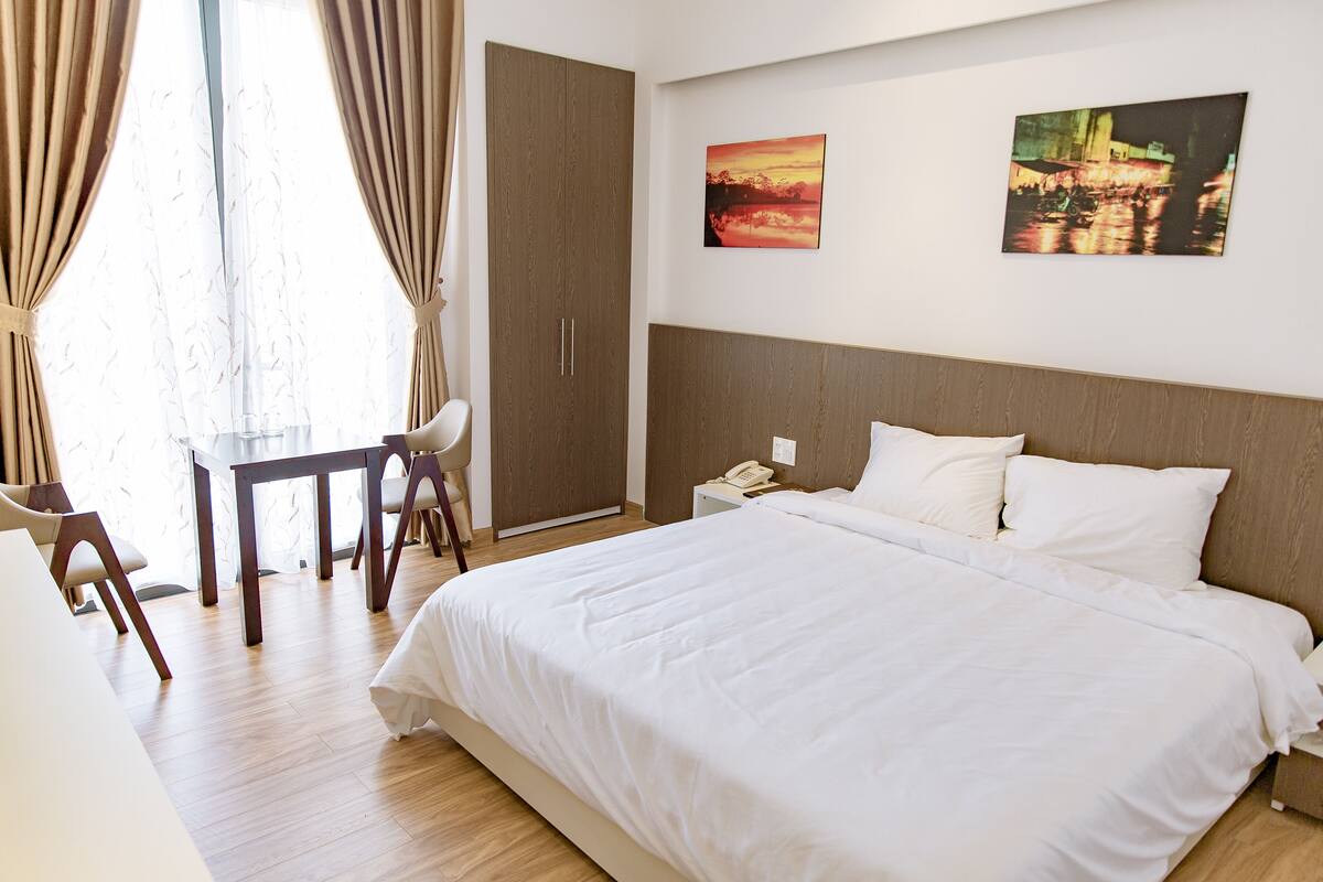 Minibar, desk, blackout curtains, iron/ironing board