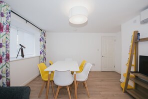 Deluxe Apartment, 2 Bedrooms | Living area | Flat-screen TV