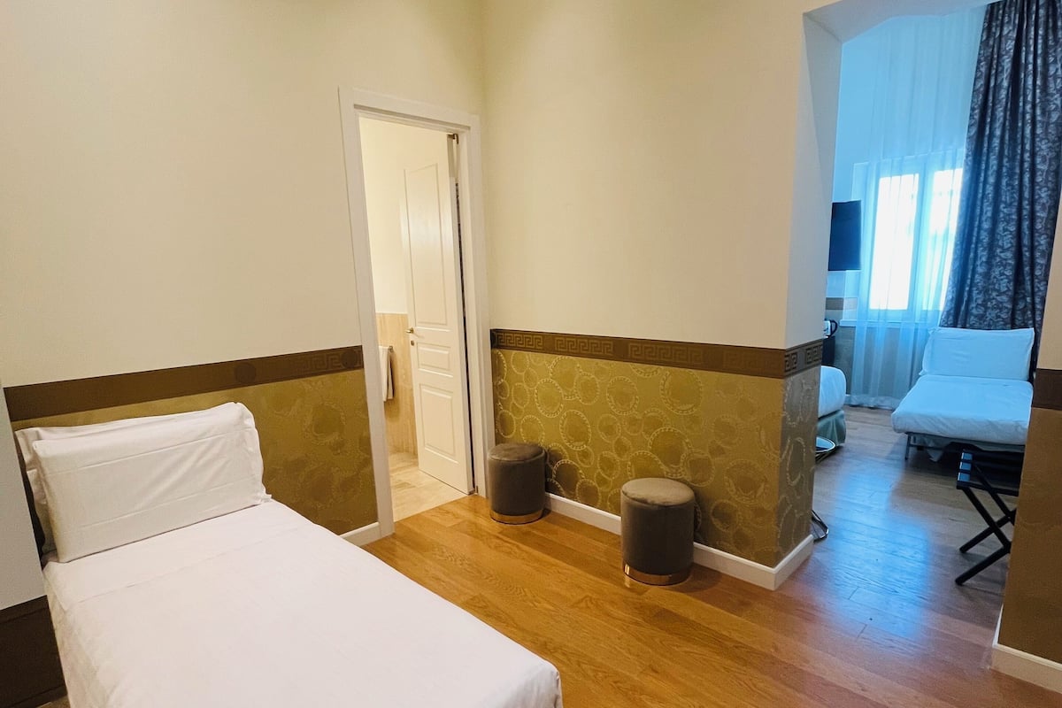 Quadruple Room | Down comforters, in-room safe, individually decorated