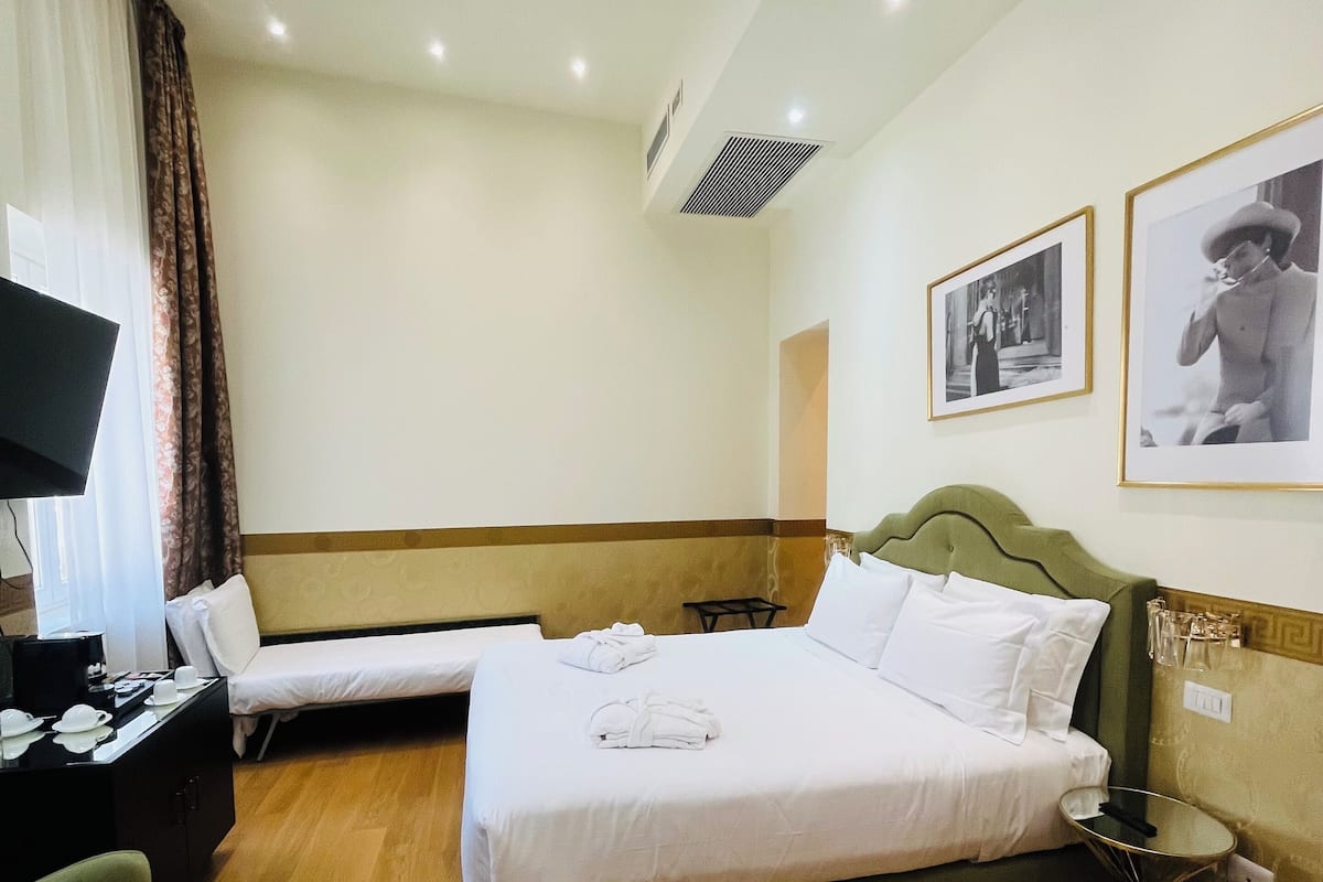 Quadruple Room | Down comforters, in-room safe, individually decorated