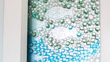 A frosted glass window with a decorative pattern.