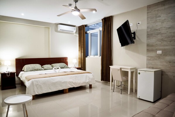 Classic Triple Room, Multiple Beds, City View | In-room safe, desk, blackout curtains, iron/ironing board