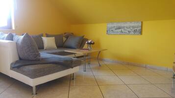 Family Condo, Garden View | Living area | TV