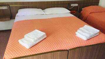 Triple Room | Desk, blackout drapes, free cribs/infant beds, free WiFi