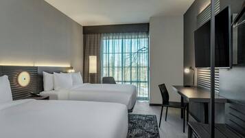 Hypo-allergenic bedding, desk, laptop workspace, blackout curtains