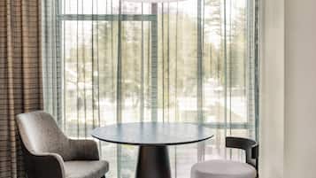 Hypo-allergenic bedding, desk, laptop workspace, blackout drapes