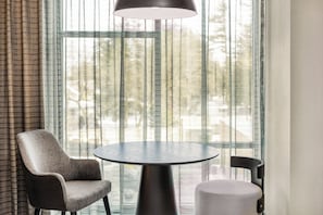 Hypo-allergenic bedding, desk, laptop workspace, blackout curtains