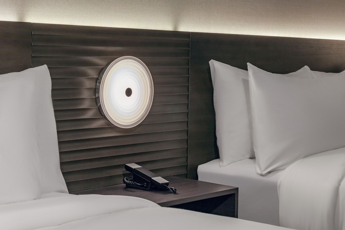 Hypo-allergenic bedding, desk, laptop workspace, blackout curtains