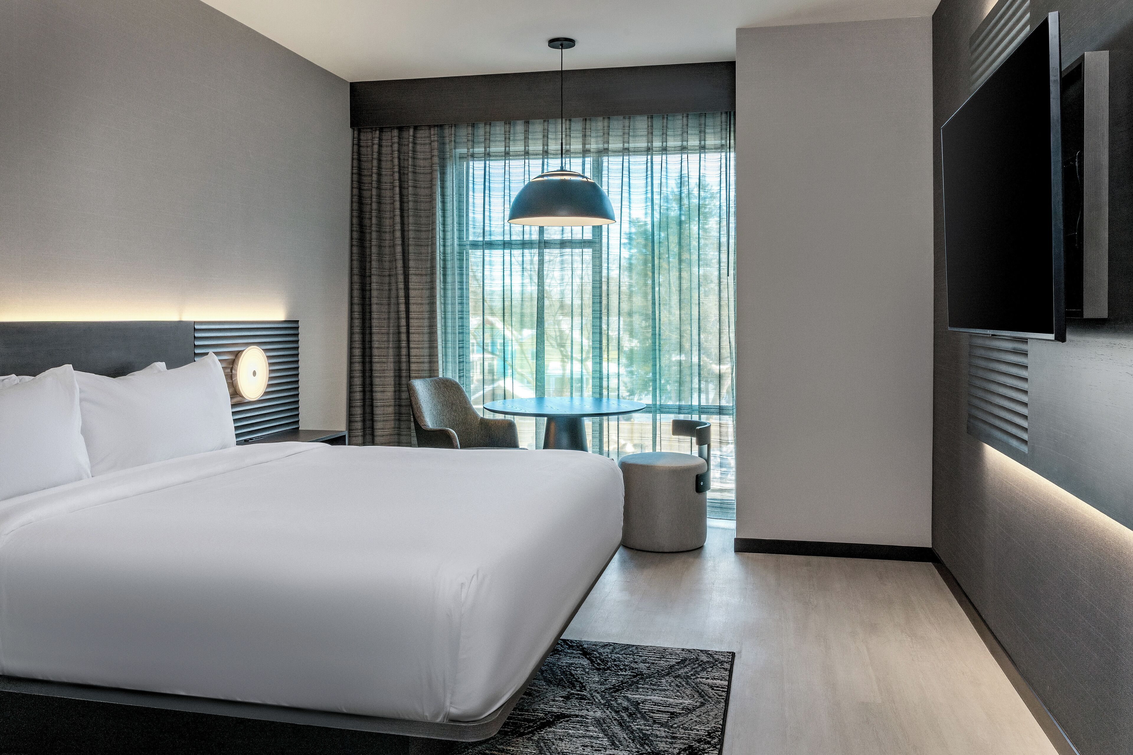 Hypo-allergenic bedding, desk, laptop workspace, blackout curtains