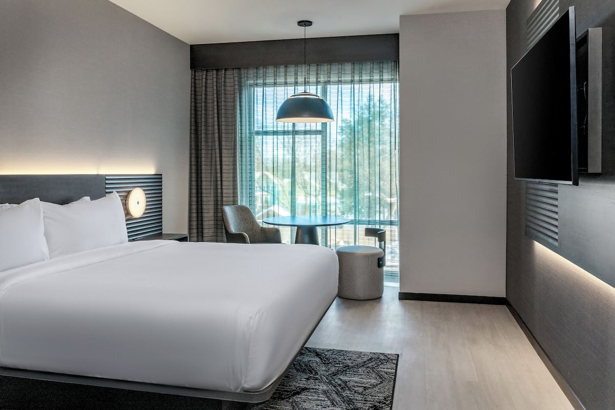 Hypo-allergenic bedding, desk, laptop workspace, blackout curtains