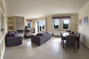 TV, fireplace - Spacious villa with privacy and mountain views, near Agia Efimia & Myrtos beach (Makriotika, Kefalonia)