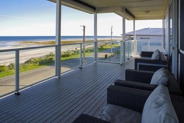 Relax on the deck with a clear view of the shoreline.