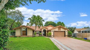 A single-story house with a tiled roof, a front garage, and a well-maintained lawn. - Heart of Wellington  (Wellington)