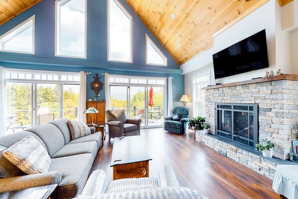 TV, fireplace, books - Secluded hilltop home with beautiful Cadillac Mountain view and multiple decks (Bar Harbor)