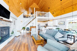 TV, fireplace, books - Secluded hilltop home with beautiful Cadillac Mountain view and multiple decks (Bar Harbor)