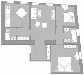 A floor plan of a hotel with a kitchen, dining area, two bathrooms, and a living room.