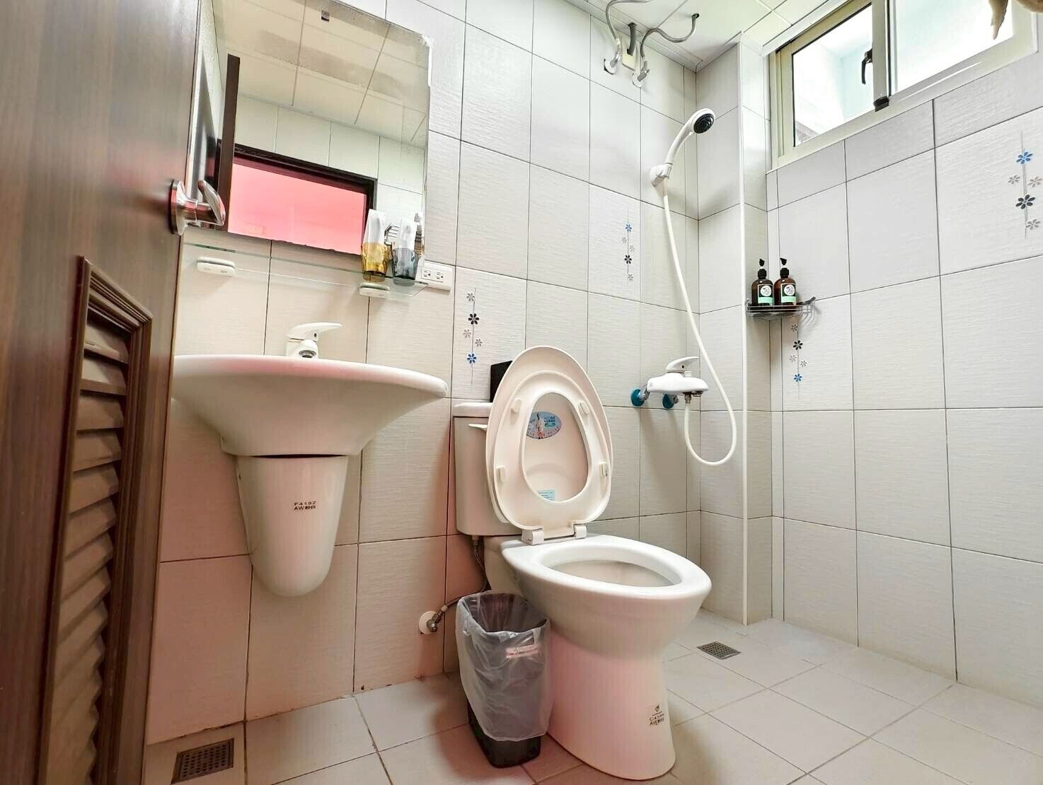 Shower, hair dryer, slippers, towels