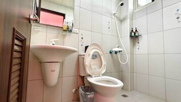 Shower, hair dryer, slippers, towels