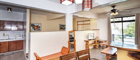 Premier Studio Suite, 1 Bedroom, Balcony, Beach View | Living area | Flat-screen TV