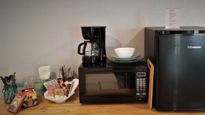 A kitchen with a coffee maker, microwave, and refrigerator. -  Quiet and Solitude with Magnificent Patio View (Kanab)