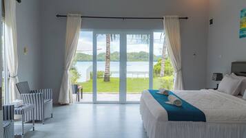 Deluxe Bungalow, 1 King Bed, Non Smoking, Beach View | 1 bedroom, in-room safe, soundproofing, free WiFi