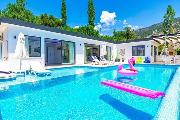 Outdoor pool, pool umbrellas, pool loungers