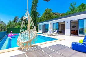 Outdoor pool, pool umbrellas, pool loungers