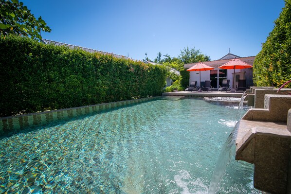 Outdoor pool, pool umbrellas, pool loungers