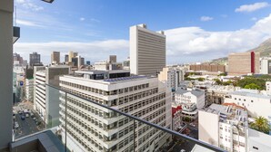 A high-rise building with multiple floors, large windows, and a modern architectural design. - The Sentinel 1310 (Cape Town)