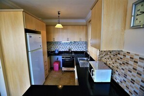 Villa, 3 chambres | Coin cuisine privé | Grand réfrigérateur, four, plaque de cuisson, lave-vaisselle