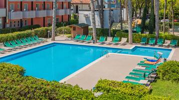 Indoor pool, seasonal outdoor pool, pool umbrellas, pool loungers