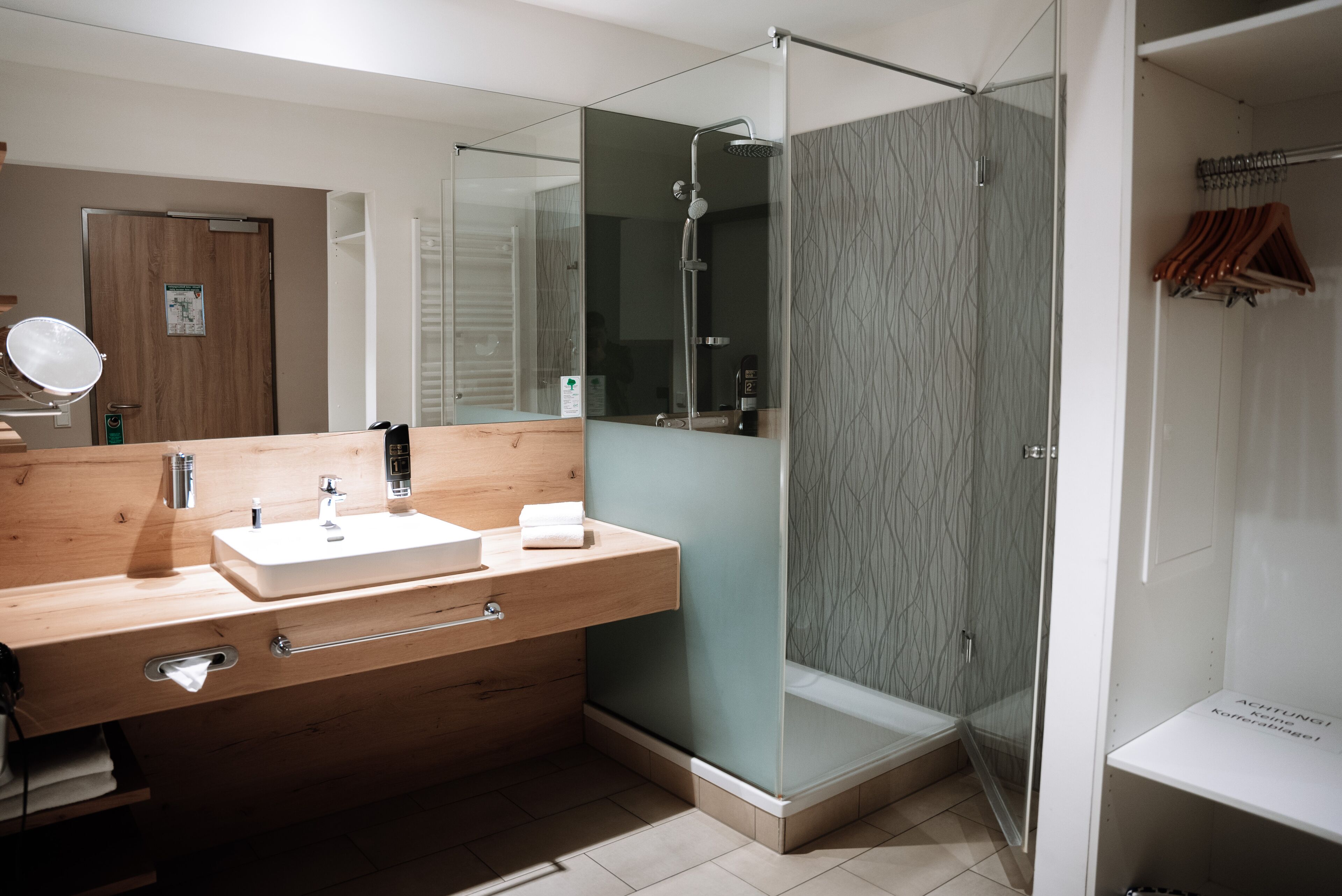 business suite | bathroom | shower, hair dryer, slippers, towels