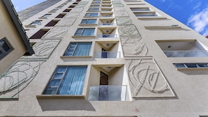 A high-rise building with multiple balconies and large windows. - L'Aziz Suites (Nairobi)