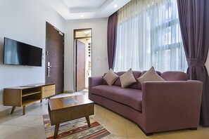 Standard Suite, 1 King Bed, City View | Living area | 52-inch Smart TV with cable channels, TV - L'Aziz Suites (Nairobi)
