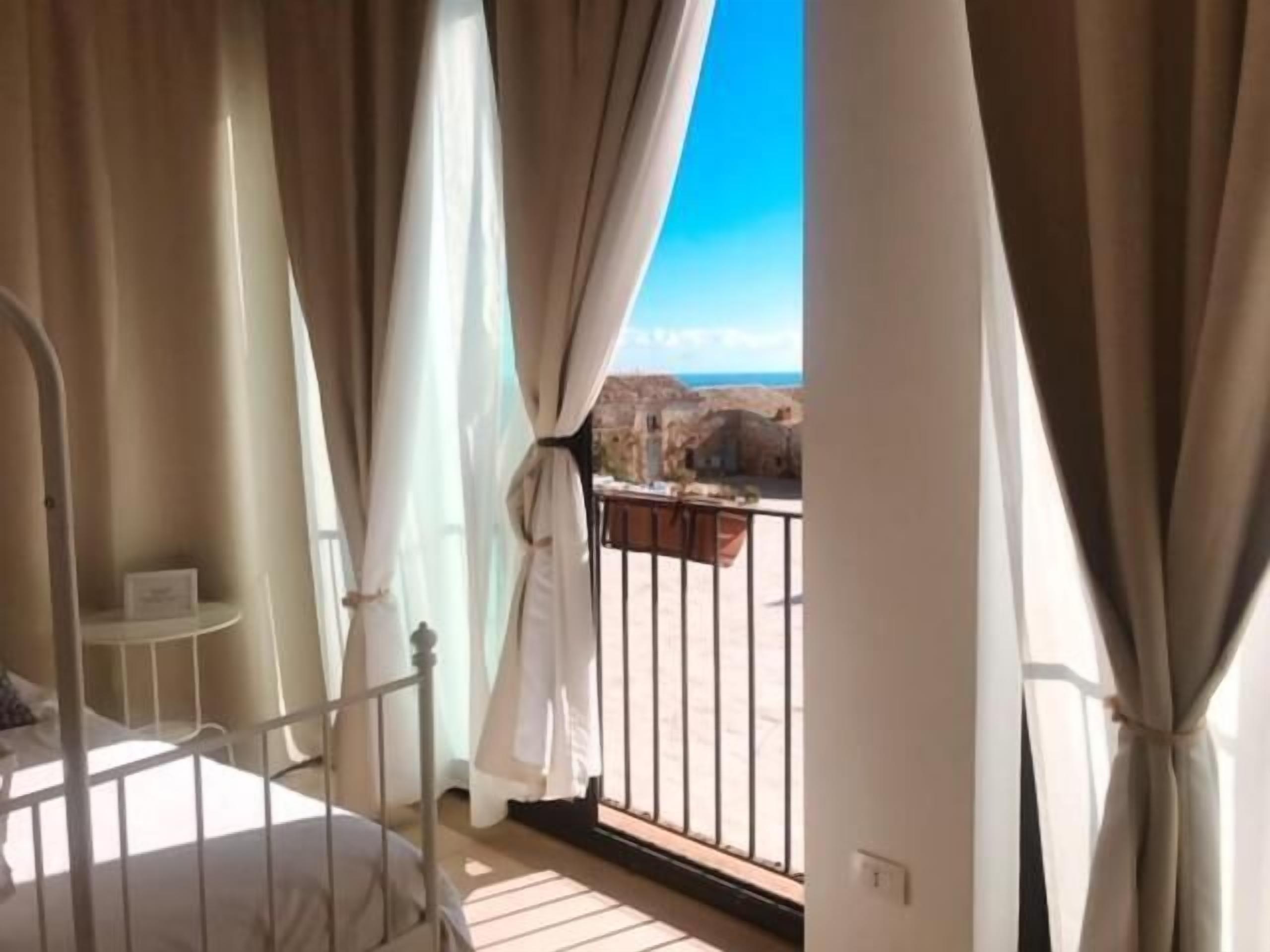 A balcony with a view of a rocky landscape.