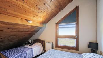 1 bedroom, desk, iron/ironing board, travel crib