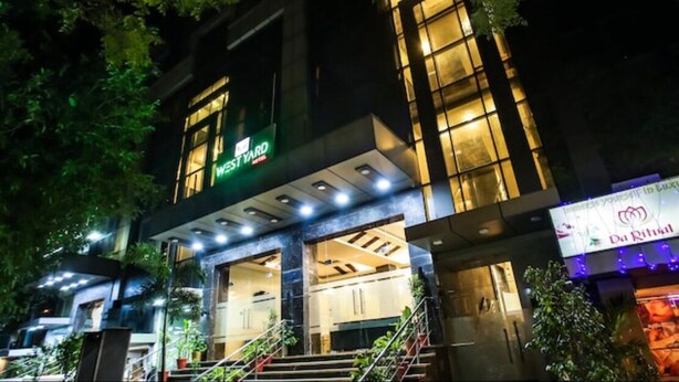 A hotel entrance with a sign reading "West Yard." - West Yard Hotels (New Delhi)