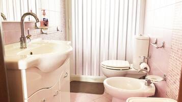 Deluxe Suite, 1 Queen Bed, Terrace, Sea View | Bathroom | Shower, hair dryer, bidet, towels