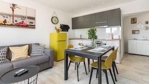 A modern apartment with a dining area, kitchen, and living space. - Lux Private Guest Suite Superb Location (Split)